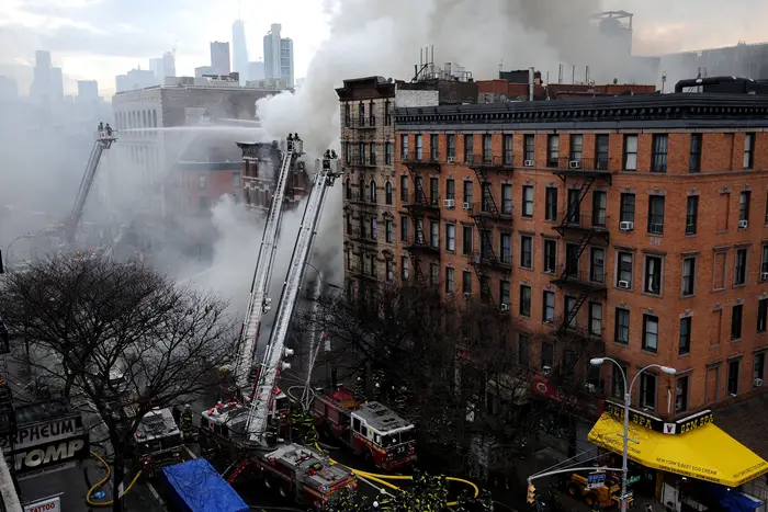 Firefighters battle a blaze caused by an explosion in a building on 2nd Avenue in the East Village of Manhattan in 2015.